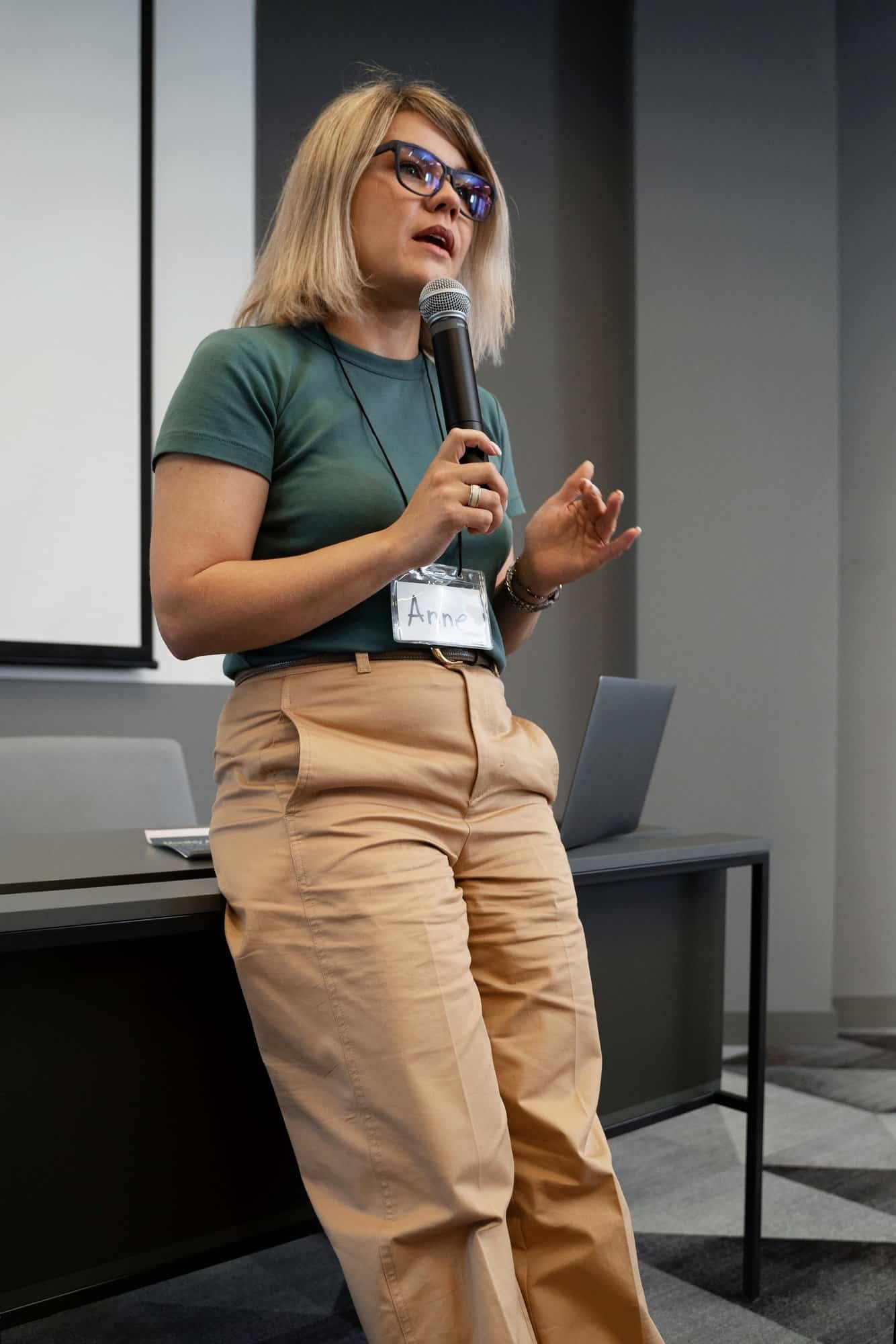 Therapist or speaker presenting at a workshop about mental health and personal growth
