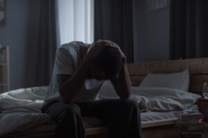 An adult in his room battling with anxiety and depression.